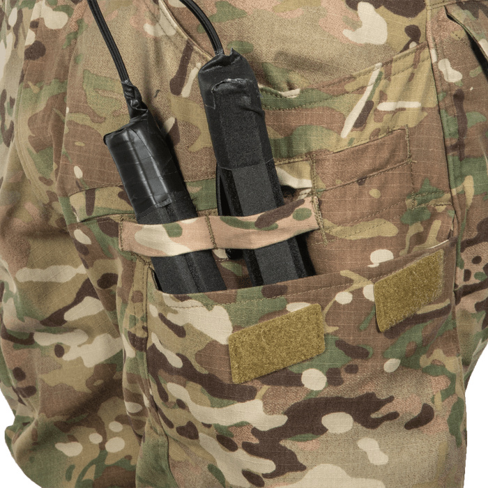 Cargo pocket pass-throughs for door charges